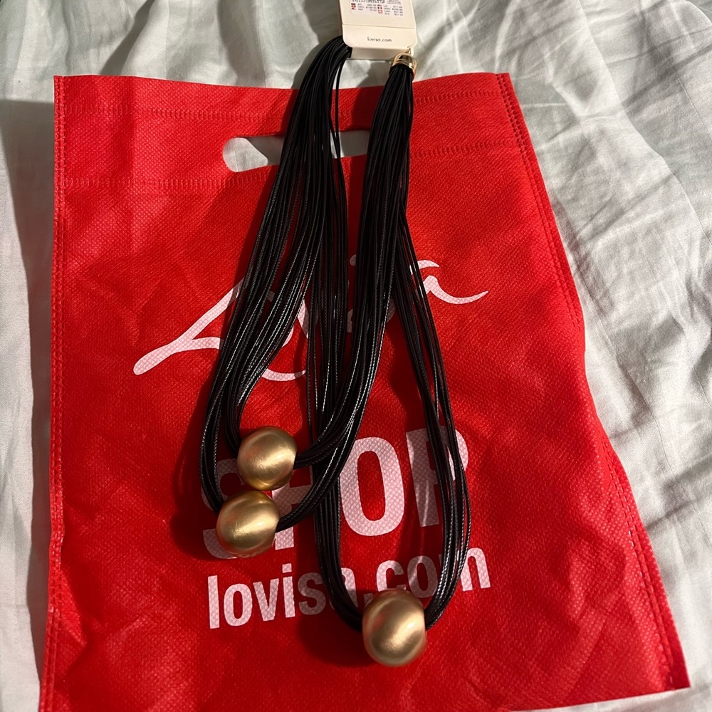 Gold bead wax strand triple necklace